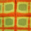 Tissu africain en bazin vert gazon, vert clair et orange au motif ruche